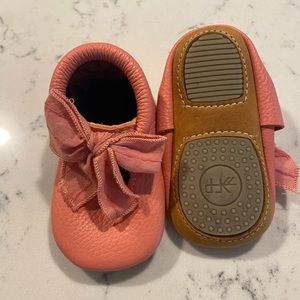 Freshly Picked coral moccasins with bow.